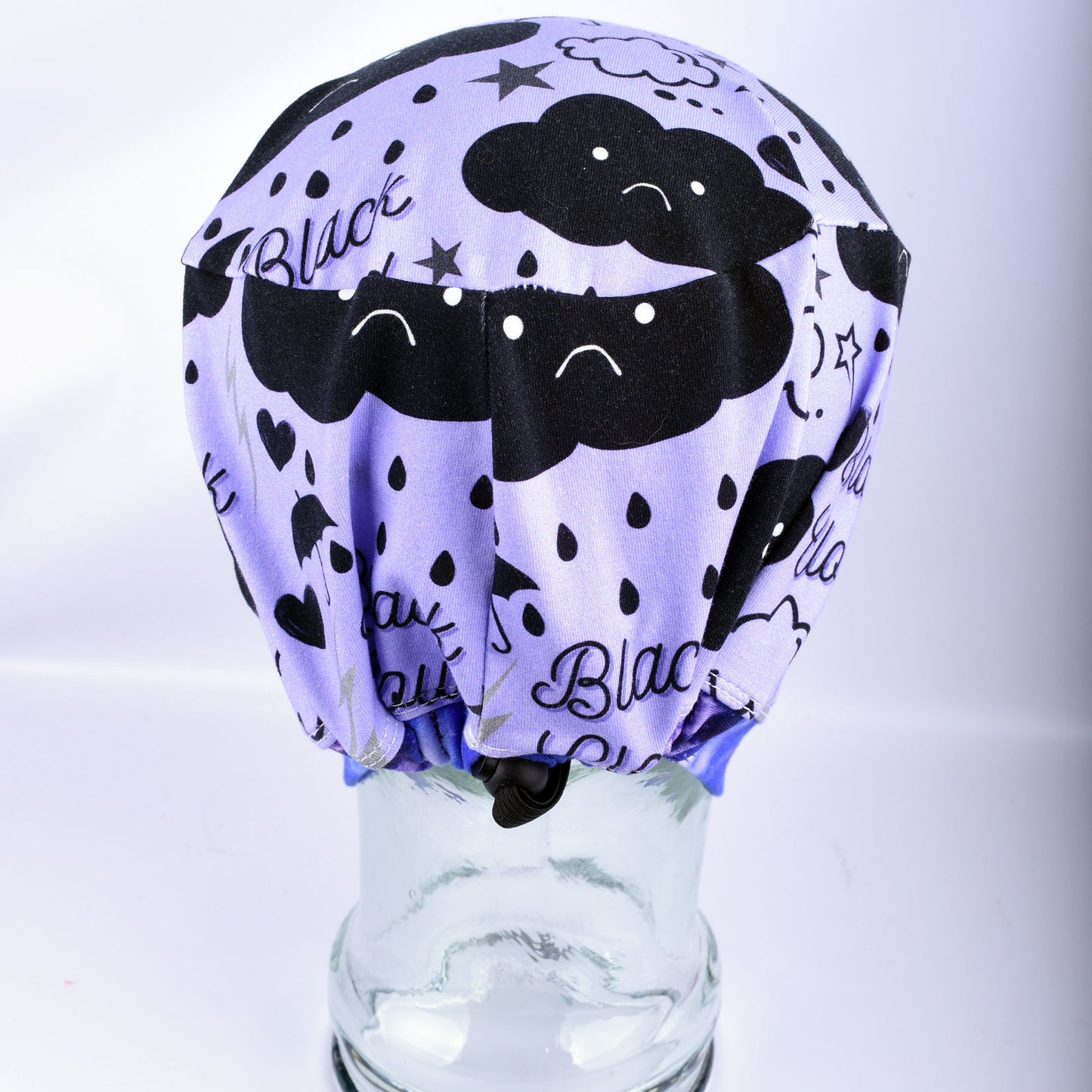 Back view of a full coverage scrub cap showing the adjustable elastic cord and black toggle for a custom fit.