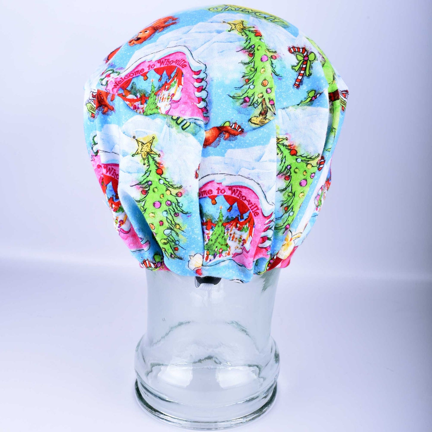 Back view of full coverage Christmas Grouch Scrub Cap with elastic band and heavy-duty cord lock