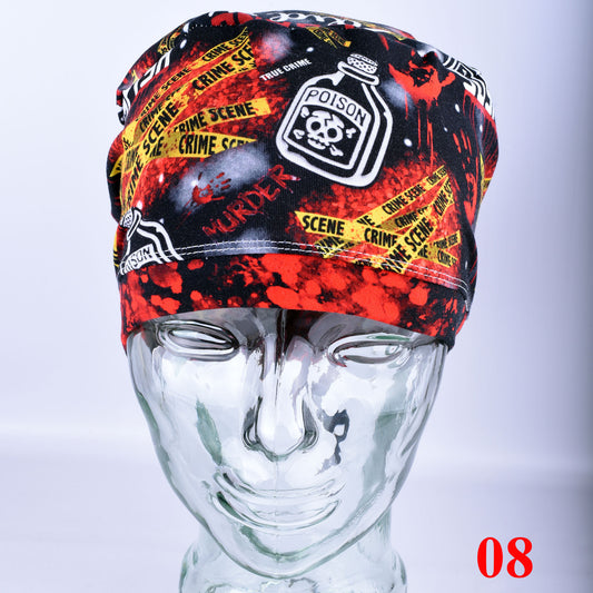Crime scene themed scrub cap featuring colorful graphic prints and text, shown on a mannequin head.