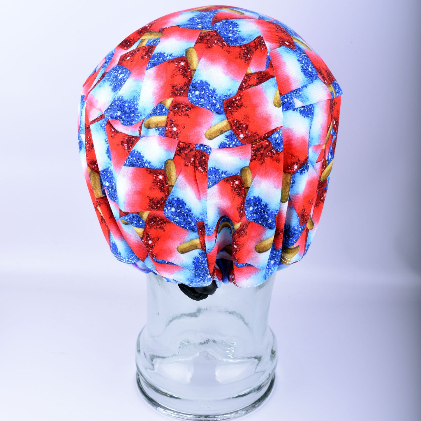 Back view of a handmade patriotic scrub cap showing the encased elastic and high-quality adjustable toggle for a customizable, stay-put fit.