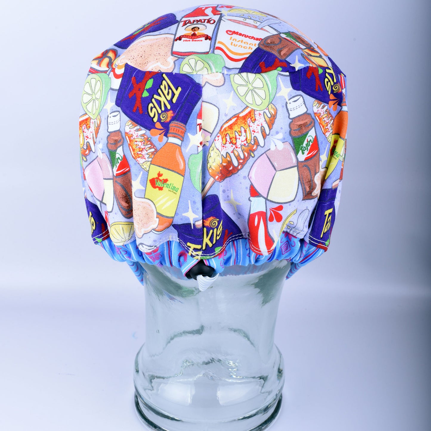 Back view of the Spicy Snacks scrub cap highlighting the adjustable cord lock toggle and encased elastic for a secure, custom fit.