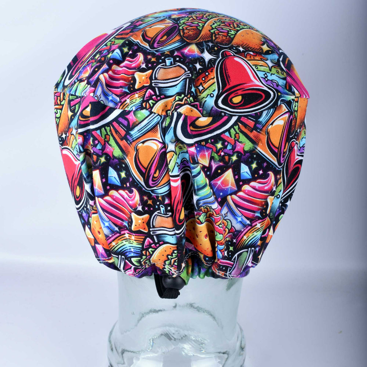 Rear view of a taco-patterned scrub cap showing the adjustable elastic drawstring and heavy-duty black toggle for a secure, custom fit.
