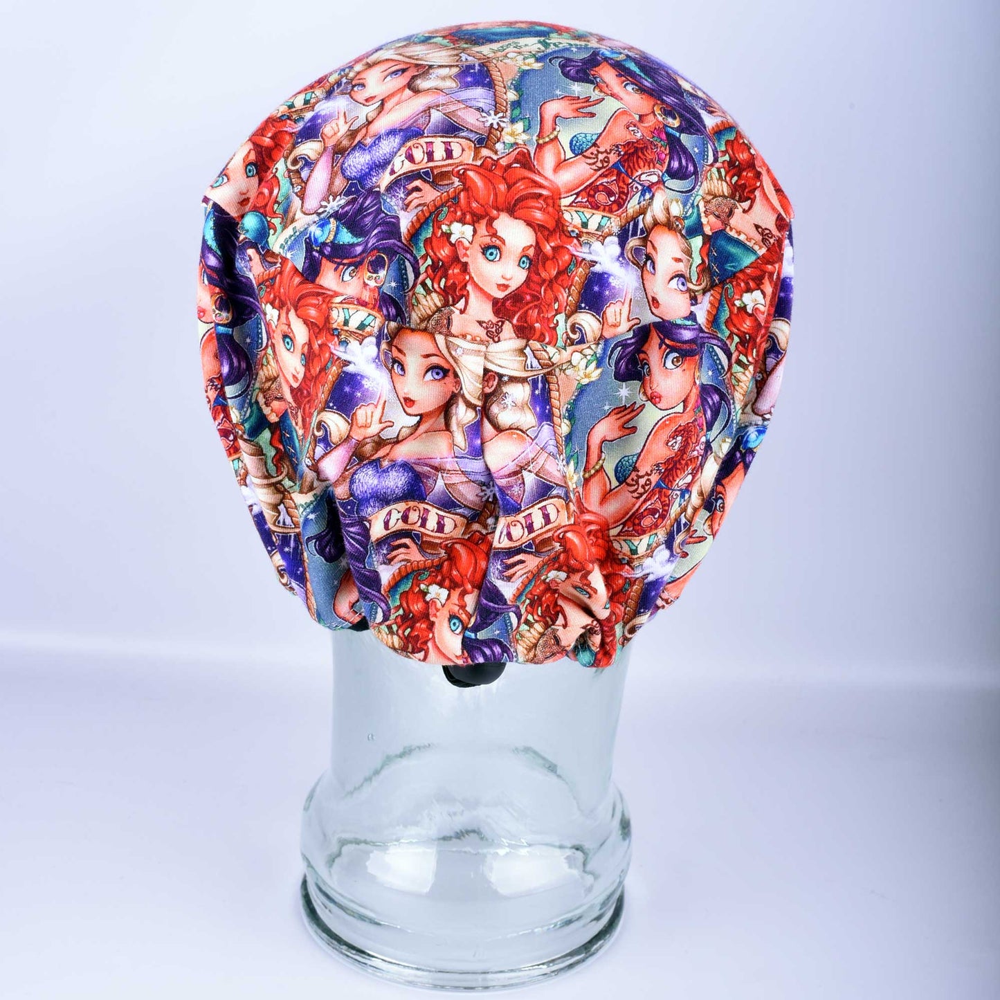 Back view of a Tattoo Princess full coverage scrub cap featuring edgy royal illustrations on a white background.