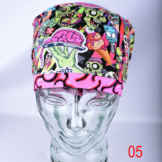 Front view of a Full Coverage Scrub Cap on a mannequin head, featuring a vibrant Halloween pattern with colorful cartoon party zombies showing exposed brains on a dark background.