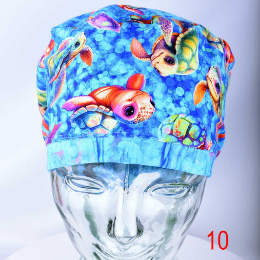 Detailed view of the exclusive, premium stretchy cotton-elastane fabric with an in-house designed whimsical baby turtle print used for scrub caps.
