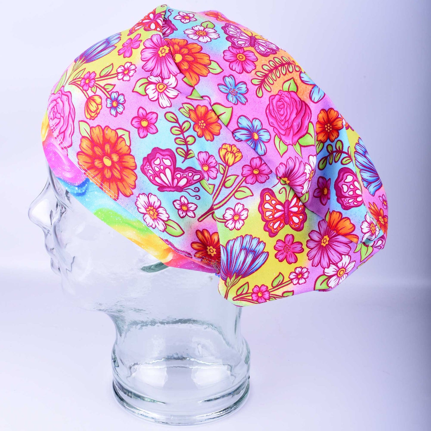 Side view of the Butterflies and Flowers scrub cap showing the full-coverage Euro style fit for long hair and the heavy-duty adjustable toggle.