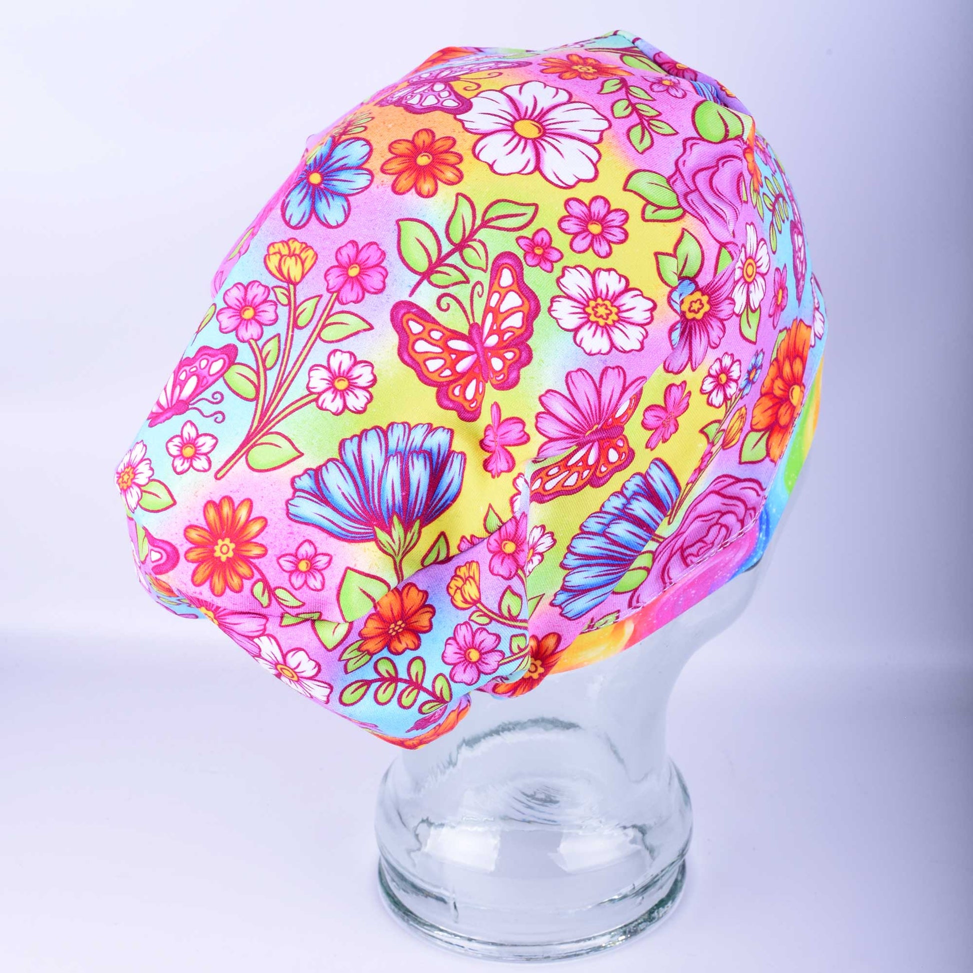 Side view of the Butterflies and Flowers scrub cap showing the full-coverage Euro style fit for long hair and the heavy-duty adjustable toggle.