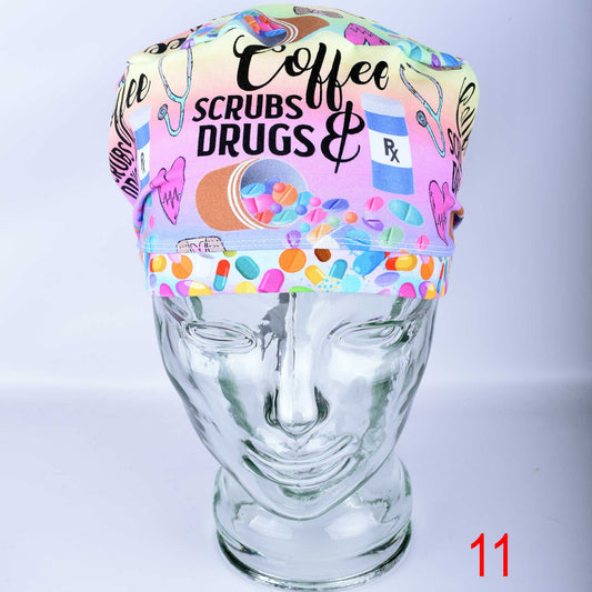 Euro-style full coverage scrub cap featuring a custom 'Coffee Scrubs Drugs' print on a white background, displayed on a glass mannequin head.