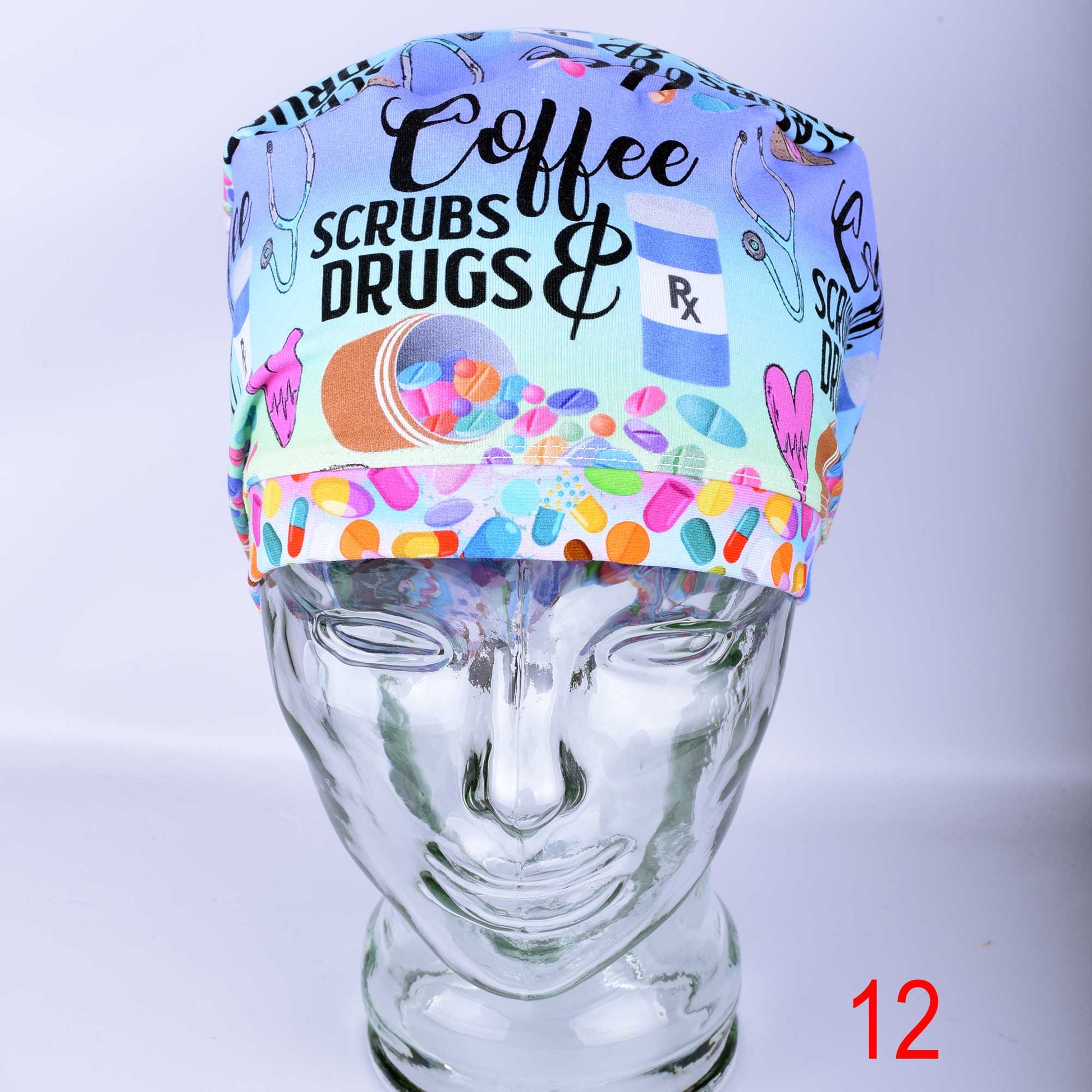 Euro-style full coverage scrub cap featuring a custom 'Coffee Scrubs Drugs' print on a white background, displayed on a glass mannequin head.