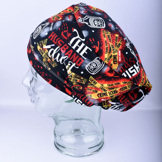 Side view of a crime scene graphic print scrub cap displaying the secure, full-coverage fit on a mannequin head.