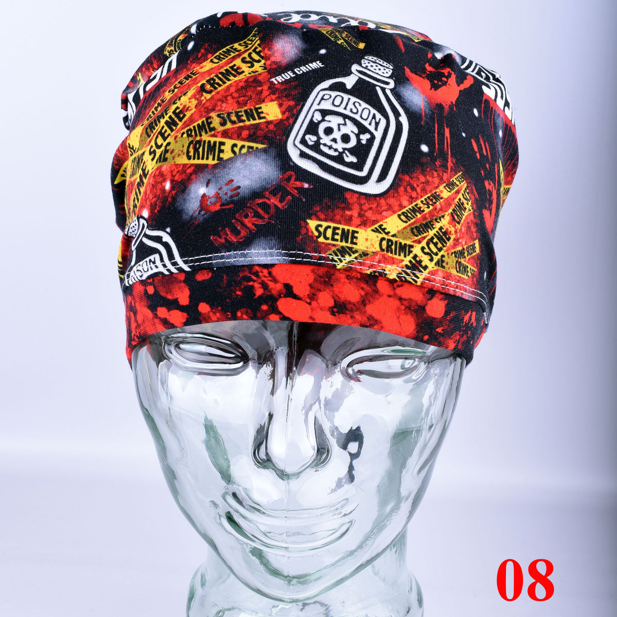 Crime scene themed scrub cap featuring colorful graphic prints and text, shown on a mannequin head.