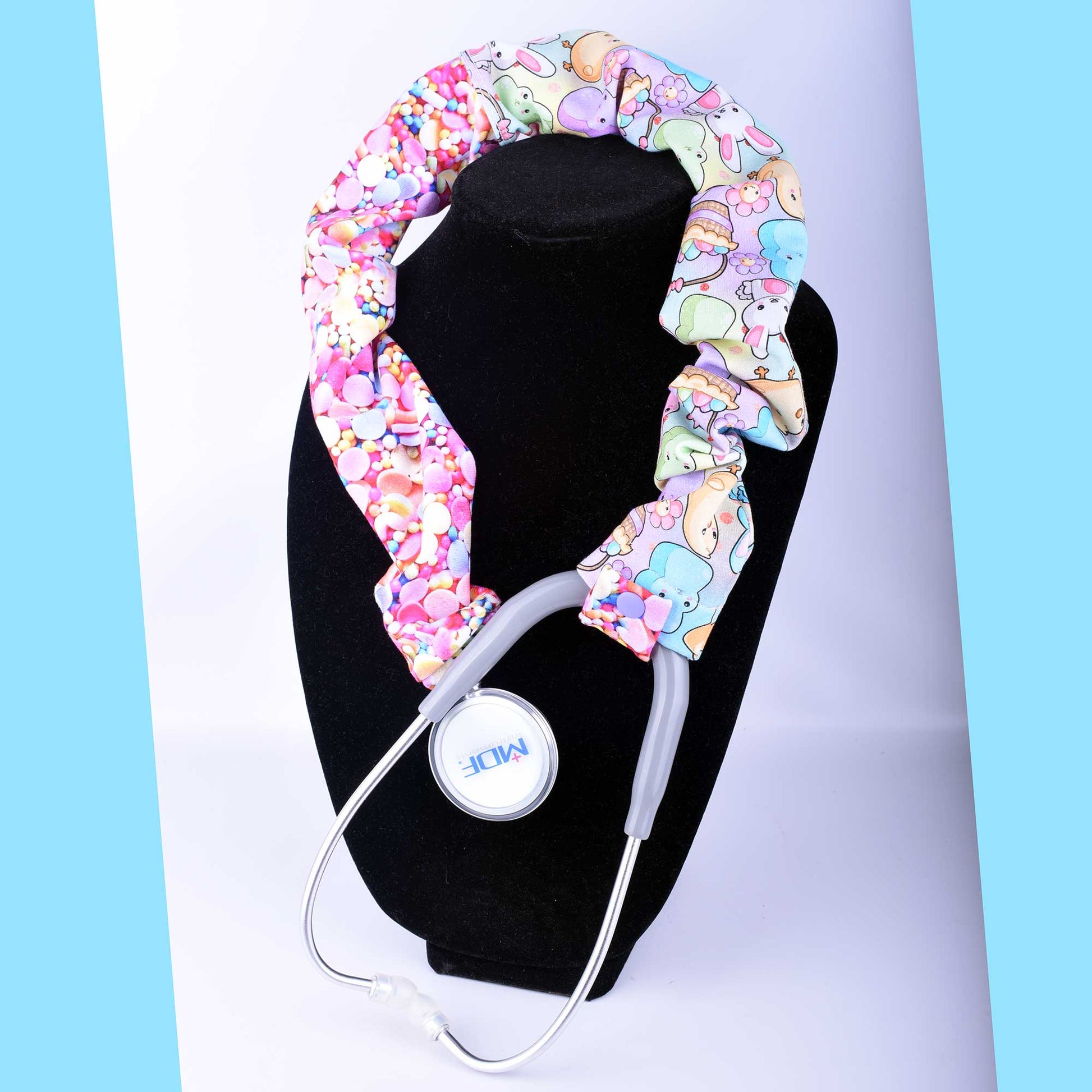 Handmade Easter Friends stethoscope cover with a festive bunny and spring floral print, shown wrapped around a gray stethoscope.