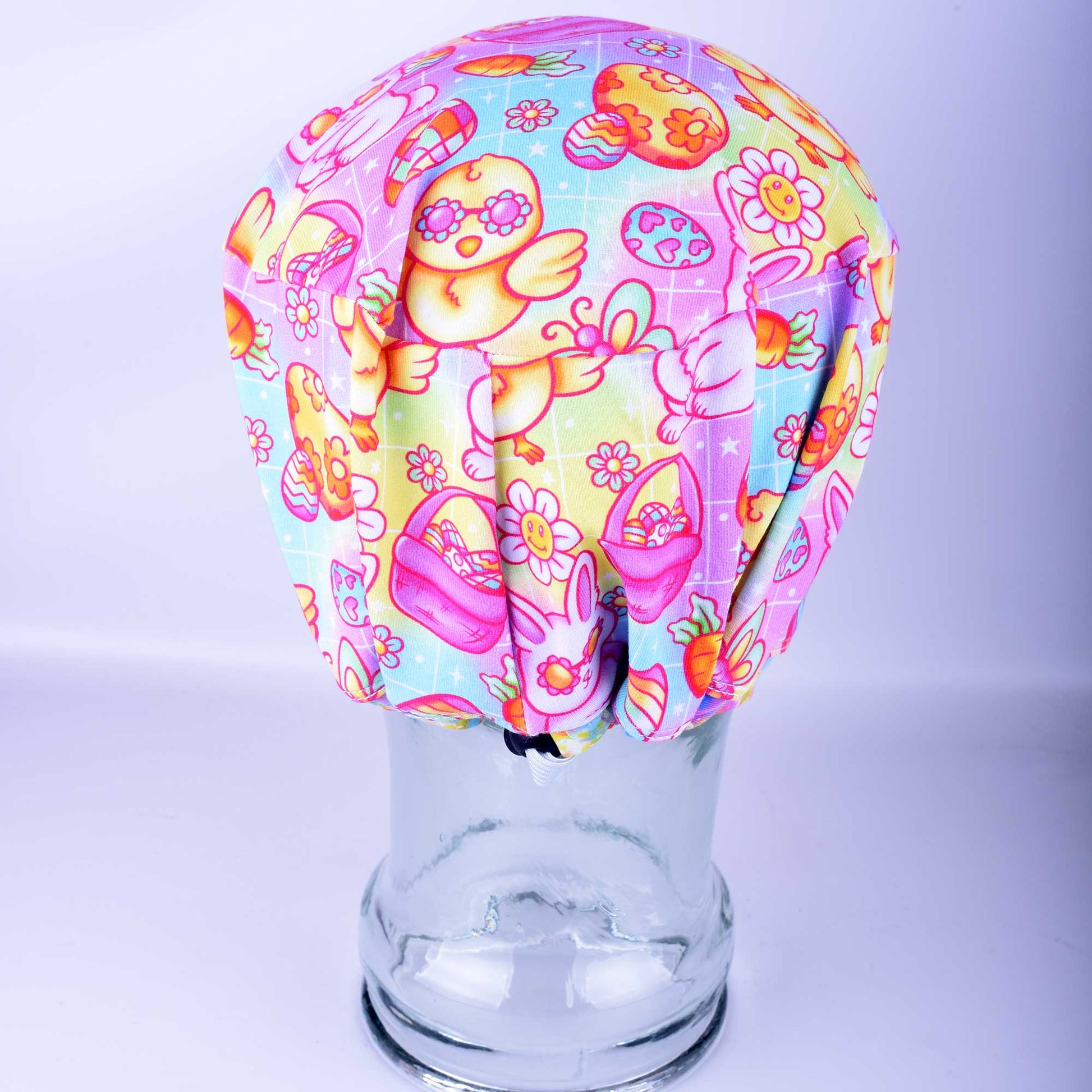 Close-up of the back of a Euro-style scrub hat showing the adjustable elastic drawstring and durable black cord lock toggle for a customizable, no-slip fit.