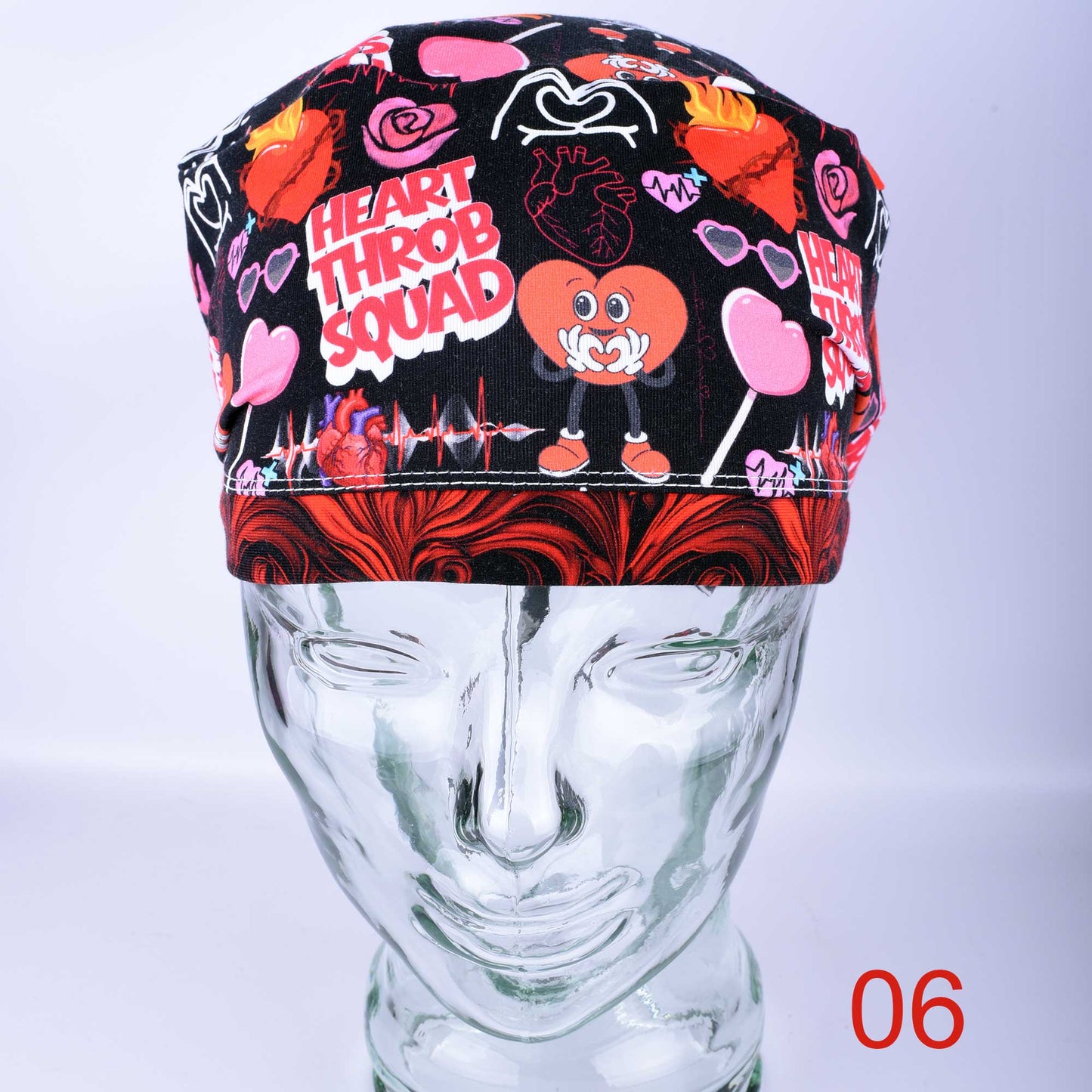 Heart Throb Squad Scrub Cap in a full-coverage style featuring a vibrant red and black cardiology-themed heart pattern.