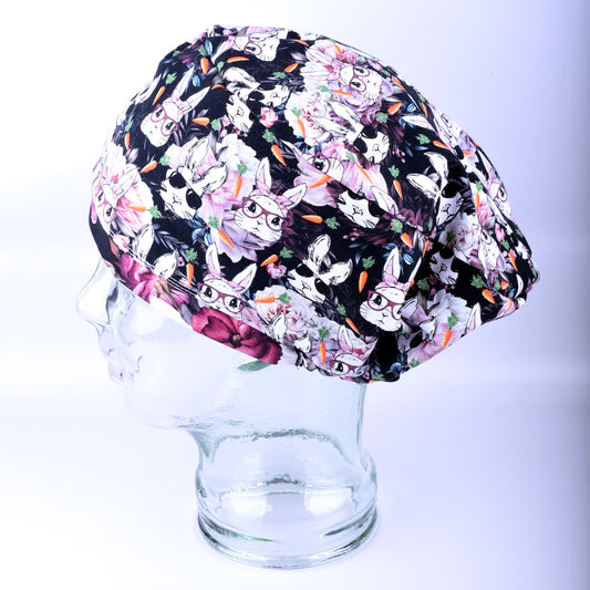 Hip Hop Rabbits full coverage scrub cap for women featuring an exclusive bunny and floral print on a dark background.
