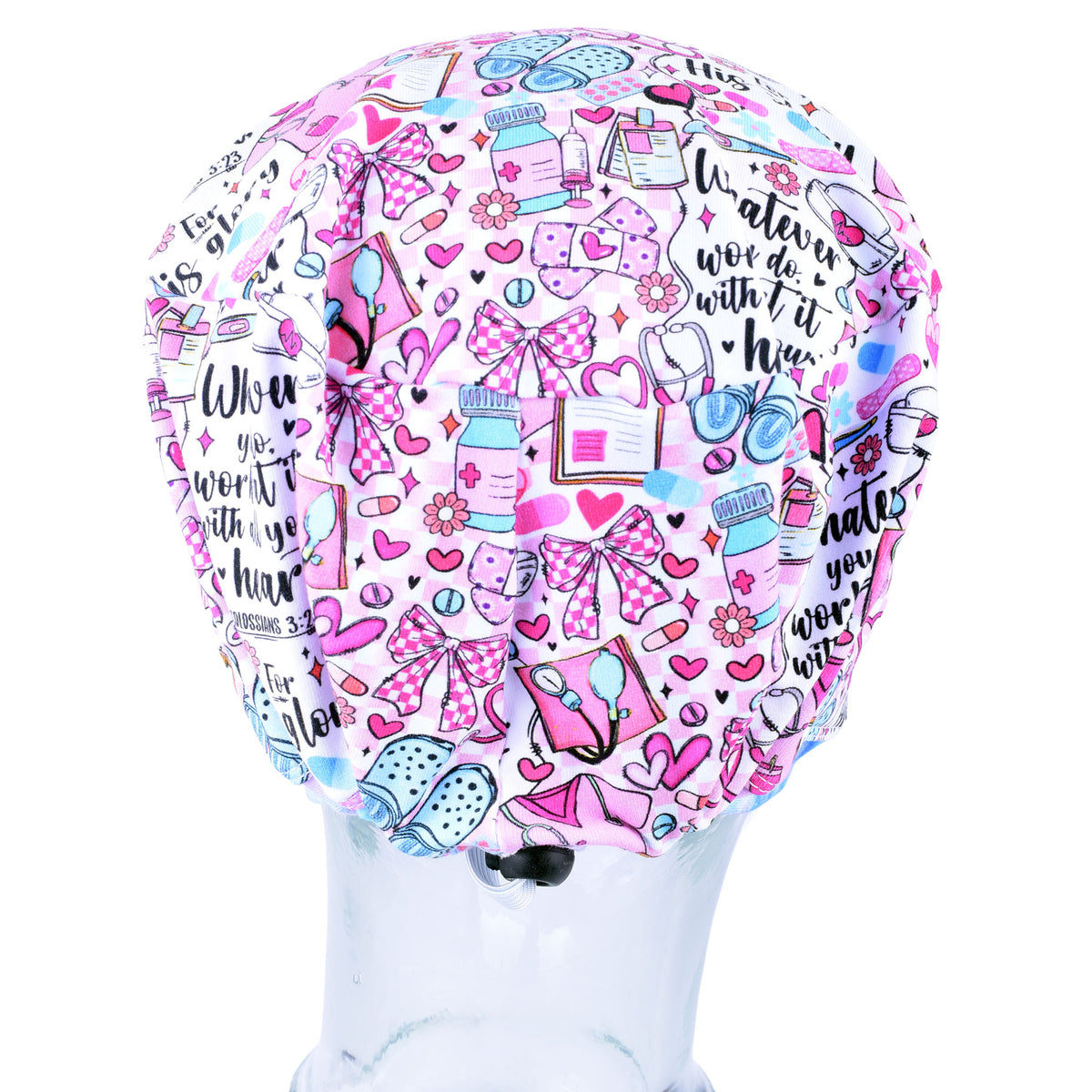 Back view of a pink and white scrub cap with a busy pattern of medicine, bows, hearts, and text, displayed on a clear mannequin head against a white background.