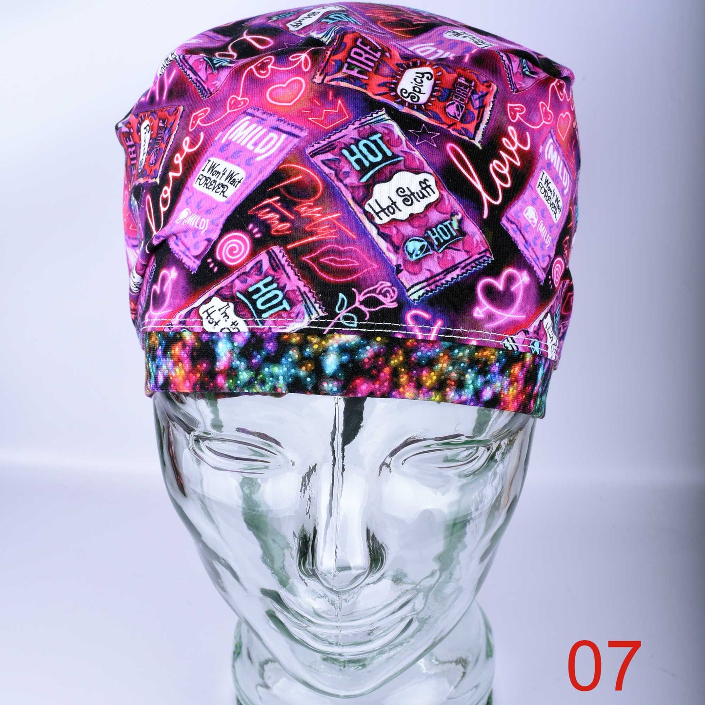 Full coverage Hot and Spicy Scrub Cap featuring a vibrant red chili pepper pattern on black fabric.