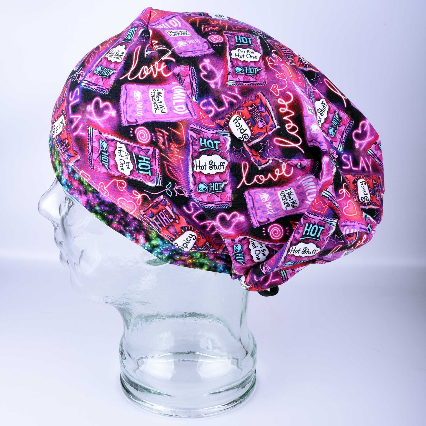 Full coverage Hot and Spicy Scrub Cap featuring a vibrant red chili pepper pattern on black fabric.