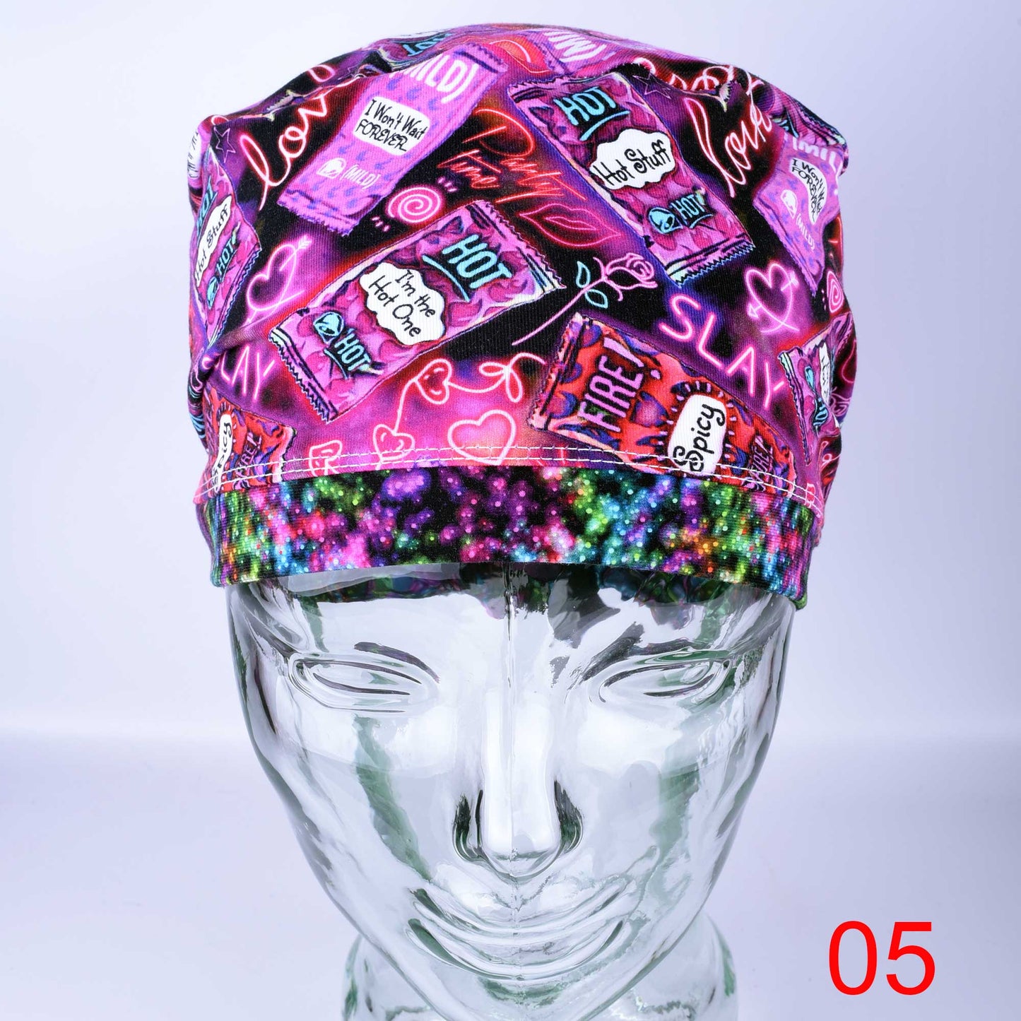 Full coverage Hot and Spicy Scrub Cap featuring a vibrant red chili pepper pattern on black fabric.