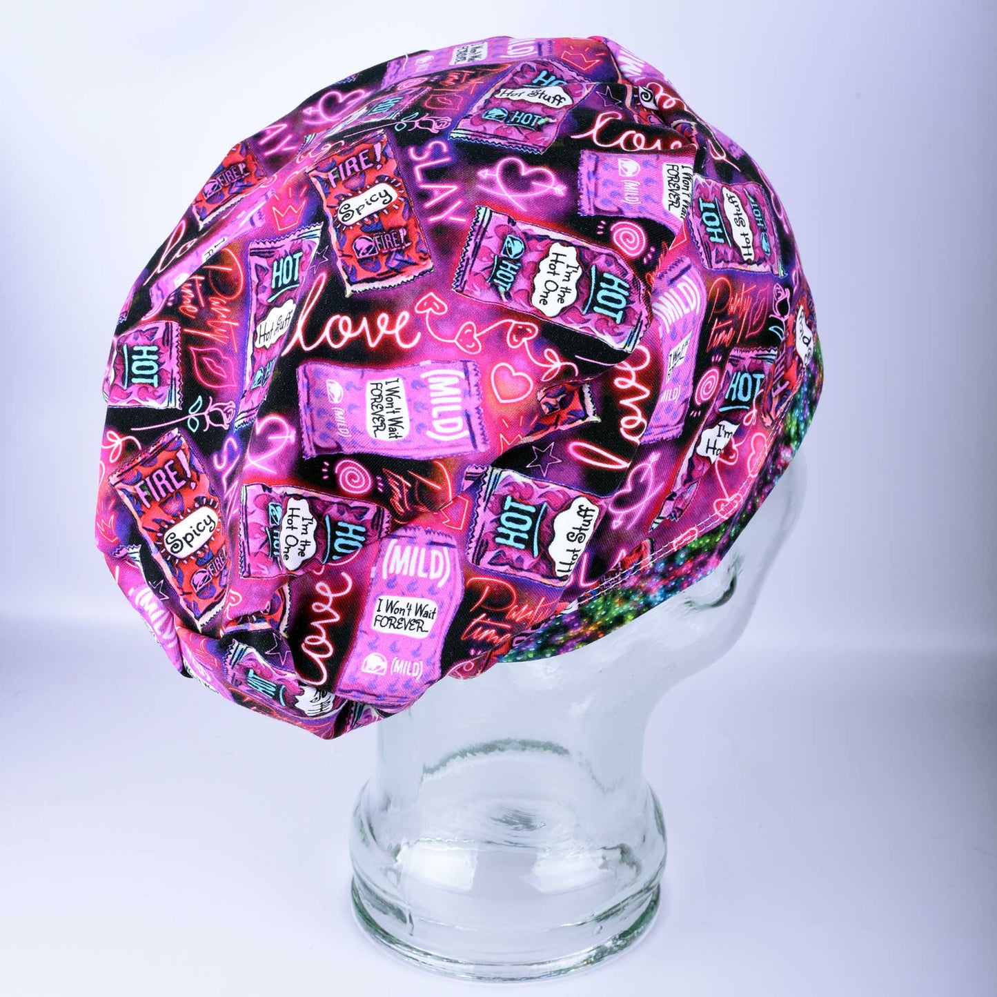 Full coverage Hot and Spicy Scrub Cap featuring a vibrant red chili pepper pattern on black fabric.
