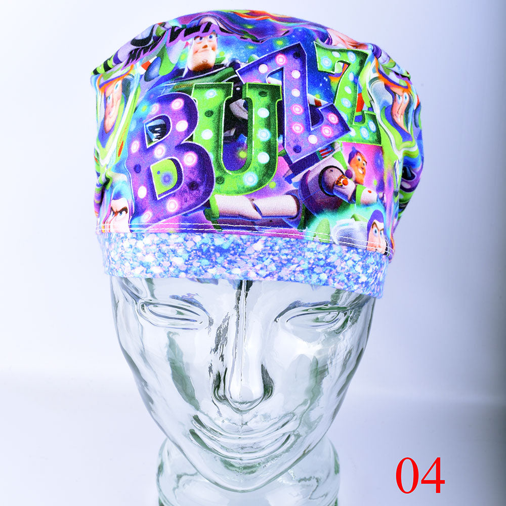 Front view of a full-coverage surgical scrub cap on a clear mannequin head, featuring a vibrant cartoon astronaut and outer space pattern on a crisp white background.