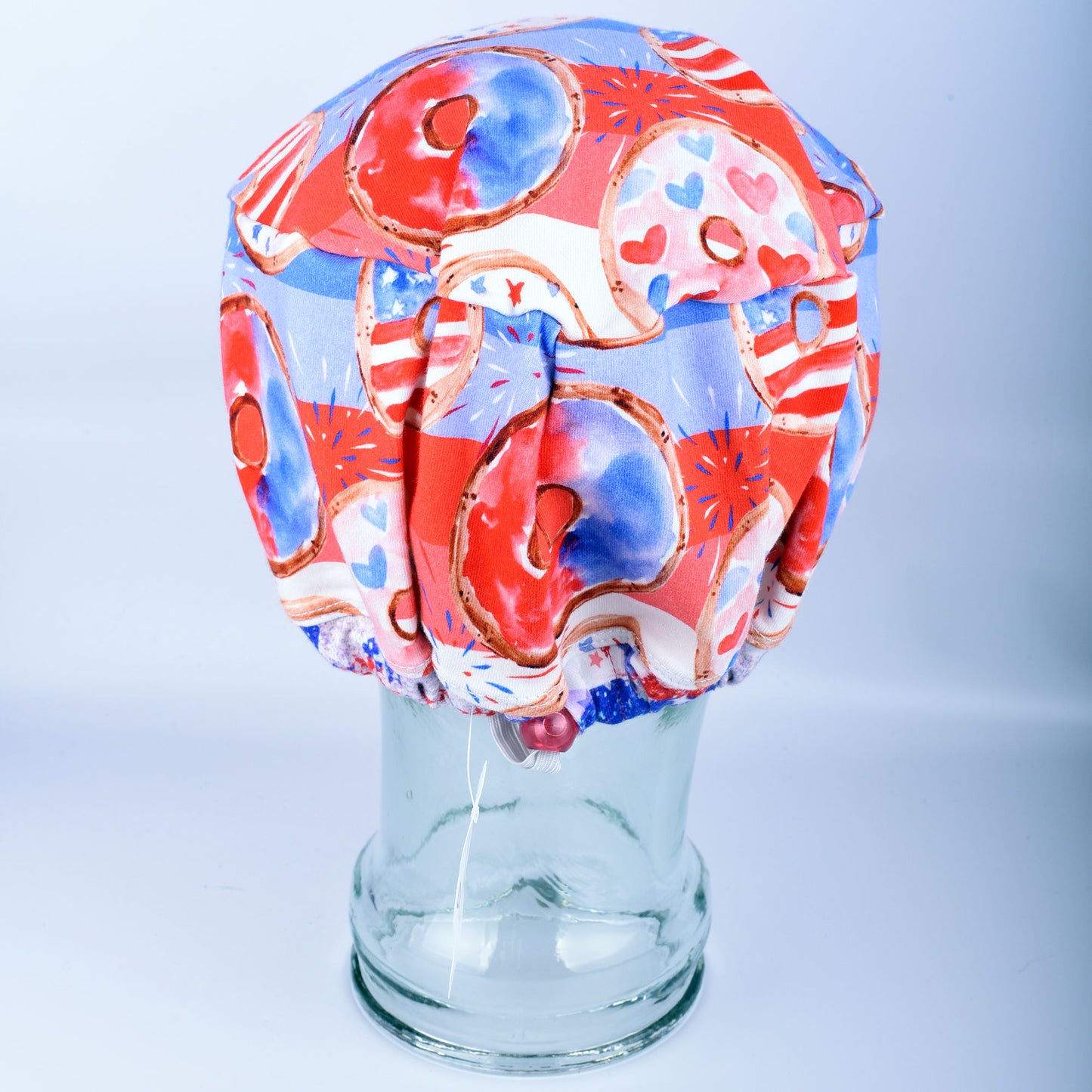 Back view of a stretchy cotton-blend scrub cap highlighting the encased elastic band for full hair coverage and comfort.