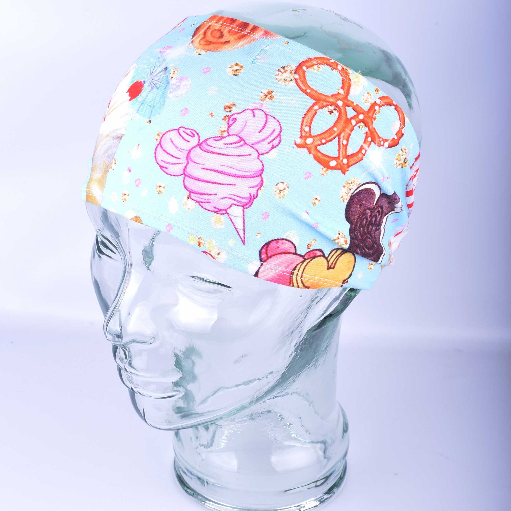 Side profile of the wide colorful snacks pattern hair band showcasing the comfortable ear coverage.