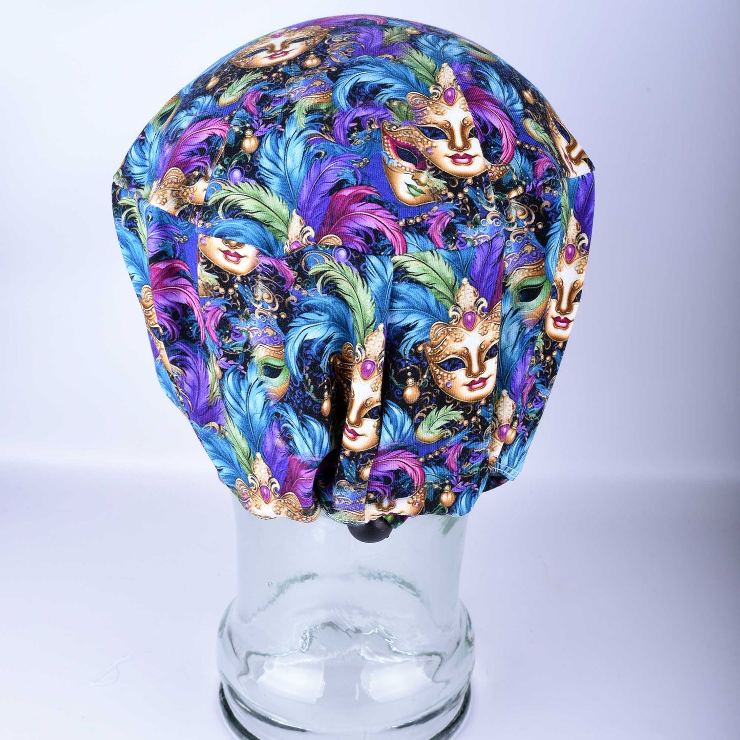 Adjustable Mardi Gras scrub cap with heavy-duty cord lock and elastic for a custom fit.