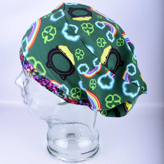 Full coverage neon St. Patrick's Day scrub cap with vibrant green and white clover patterns on a black background.