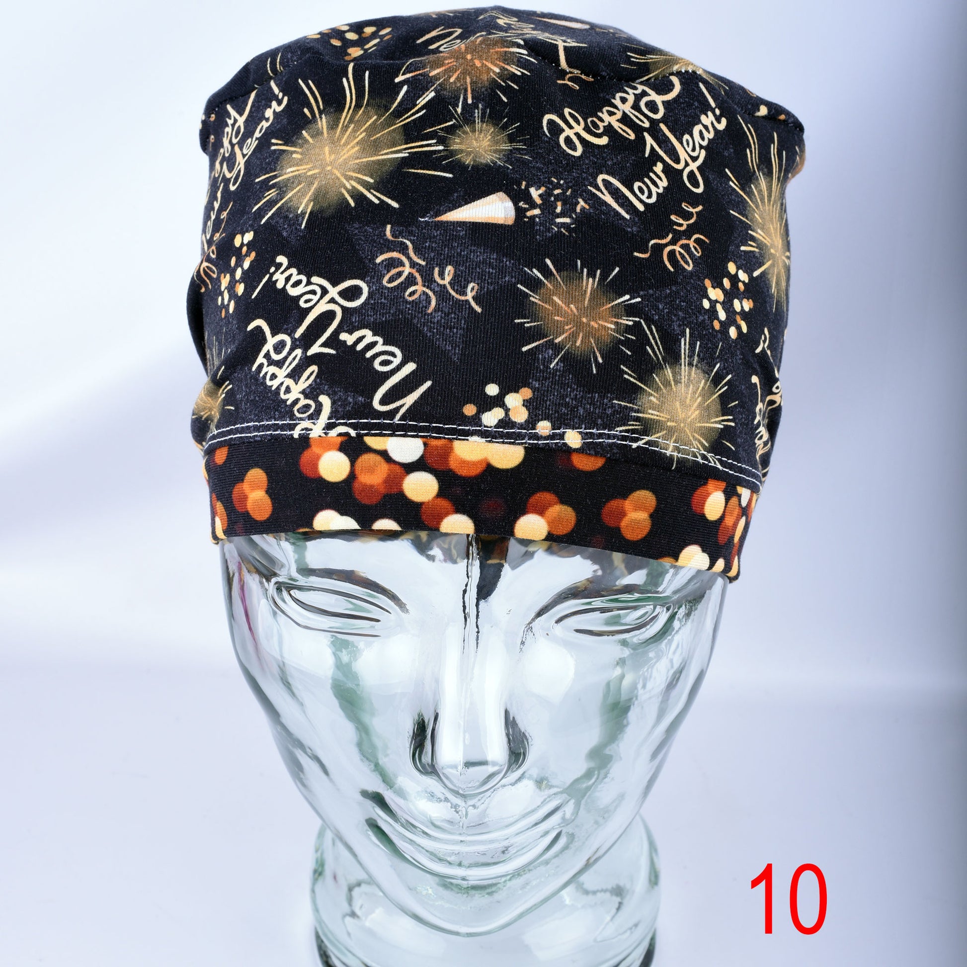 Front view of the New Year Celebration scrub cap showing full-coverage fit and colorful party graphics.