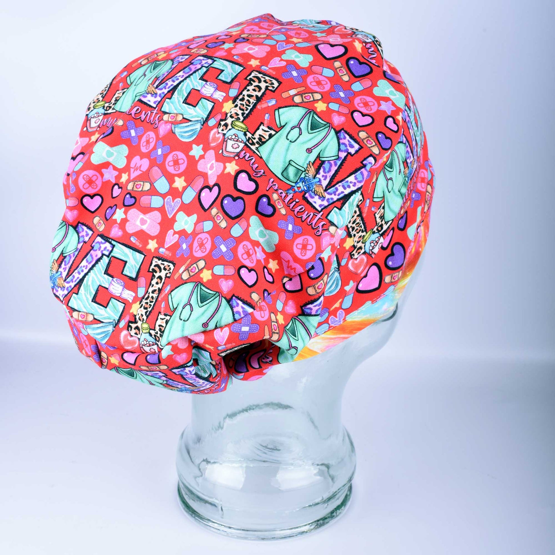Patient Love Heart Print Scrub Cap for nurses and doctors featuring a vibrant multicolor heart pattern.