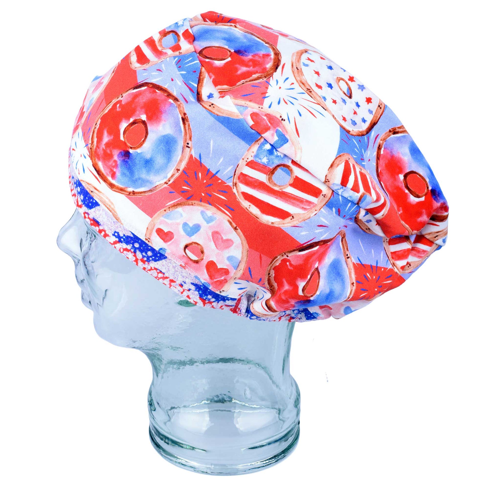 Close-up of premium breathable knit fabric on a patriotic donut scrub cap, showing high-quality print detail and stitching.