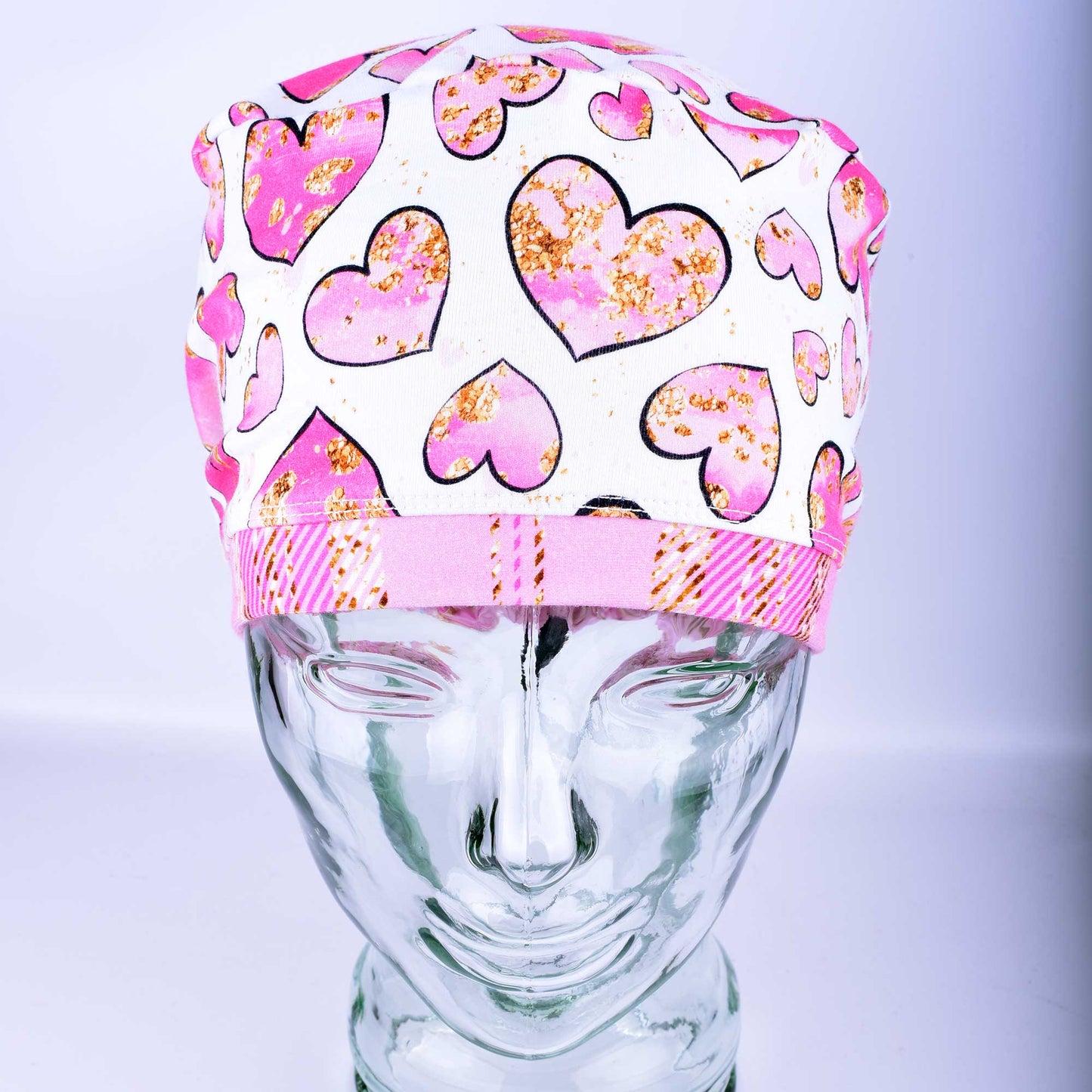 Pink Gold Hearts Scrub Cap featuring hand-drawn pink and gold hearts on a stretchy white knit fabric.