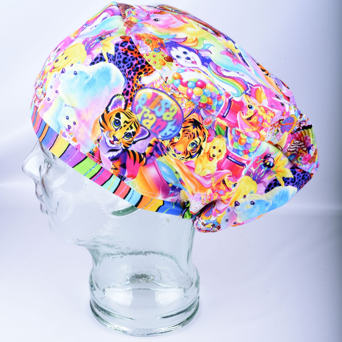 Rainbow Friends Scrub Cap side view showing vibrant nostalgic rainbow, tiger, and animal artwork on glass mannequin head.