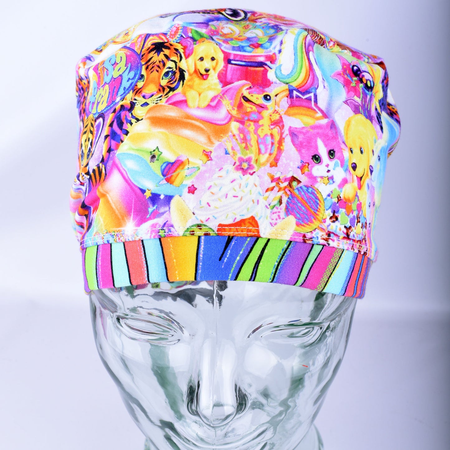 Front view of Rainbow Friends Scrub Cap displaying full forehead coverage and colorful animal print design