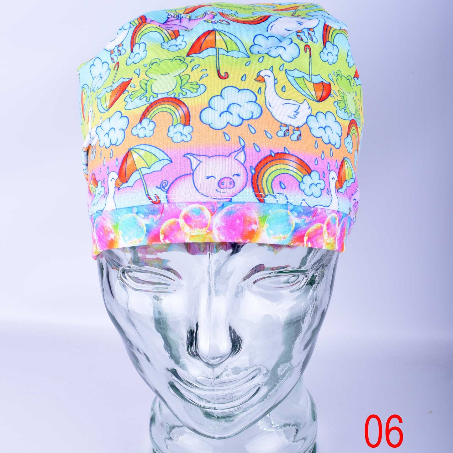 Close-up of premium blue raindrop print cotton-elastane knit fabric for medical scrub caps, showing the soft texture and vibrant colors.