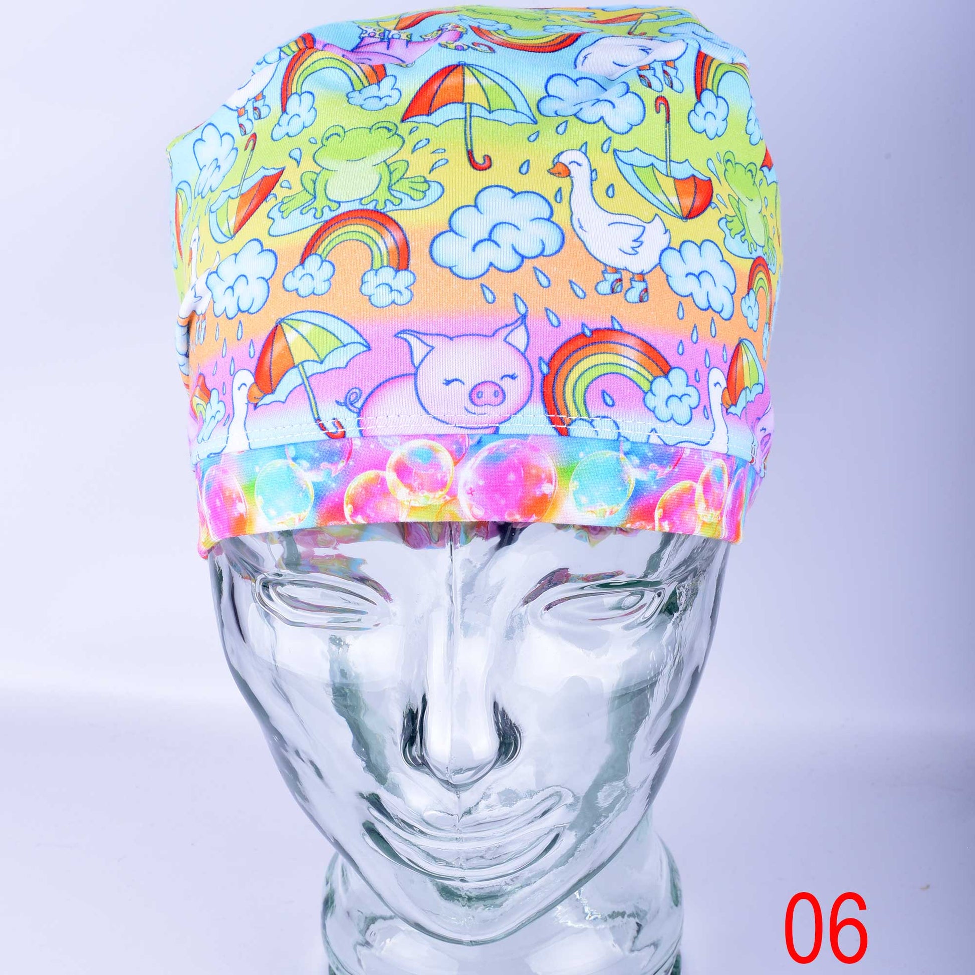 Close-up of premium blue raindrop print cotton-elastane knit fabric for medical scrub caps, showing the soft texture and vibrant colors.