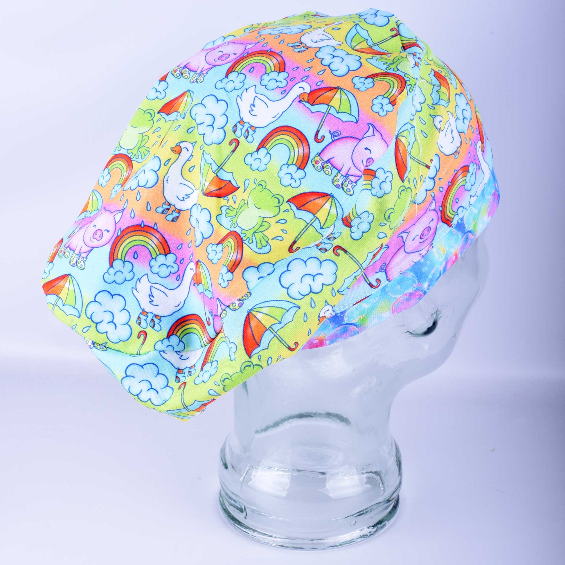 Close-up of premium blue raindrop print cotton-elastane knit fabric for medical scrub caps, showing the soft texture and vibrant colors.