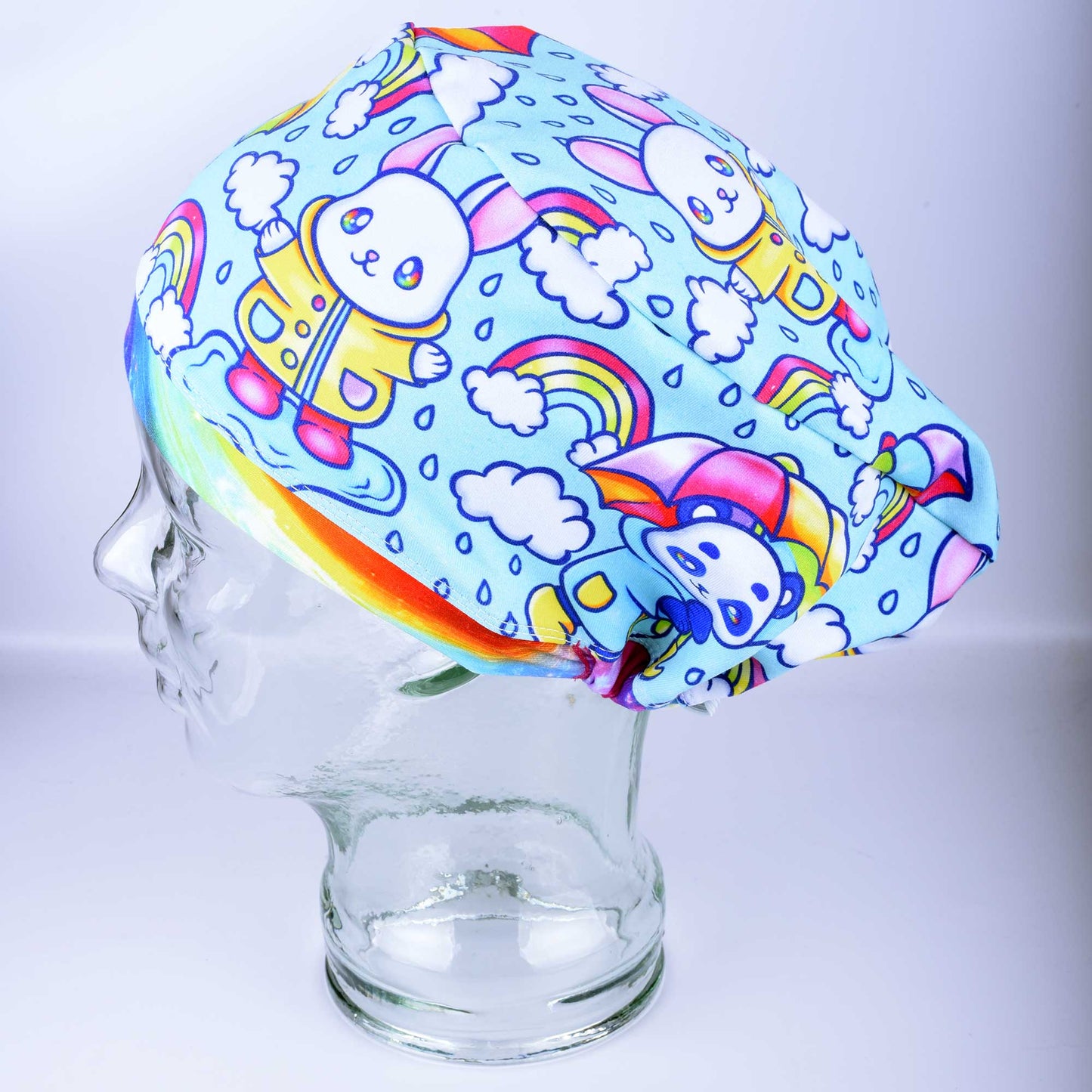 Rainy Days Euro-style scrub cap with blue and white raindrop pattern and adjustable toggle.