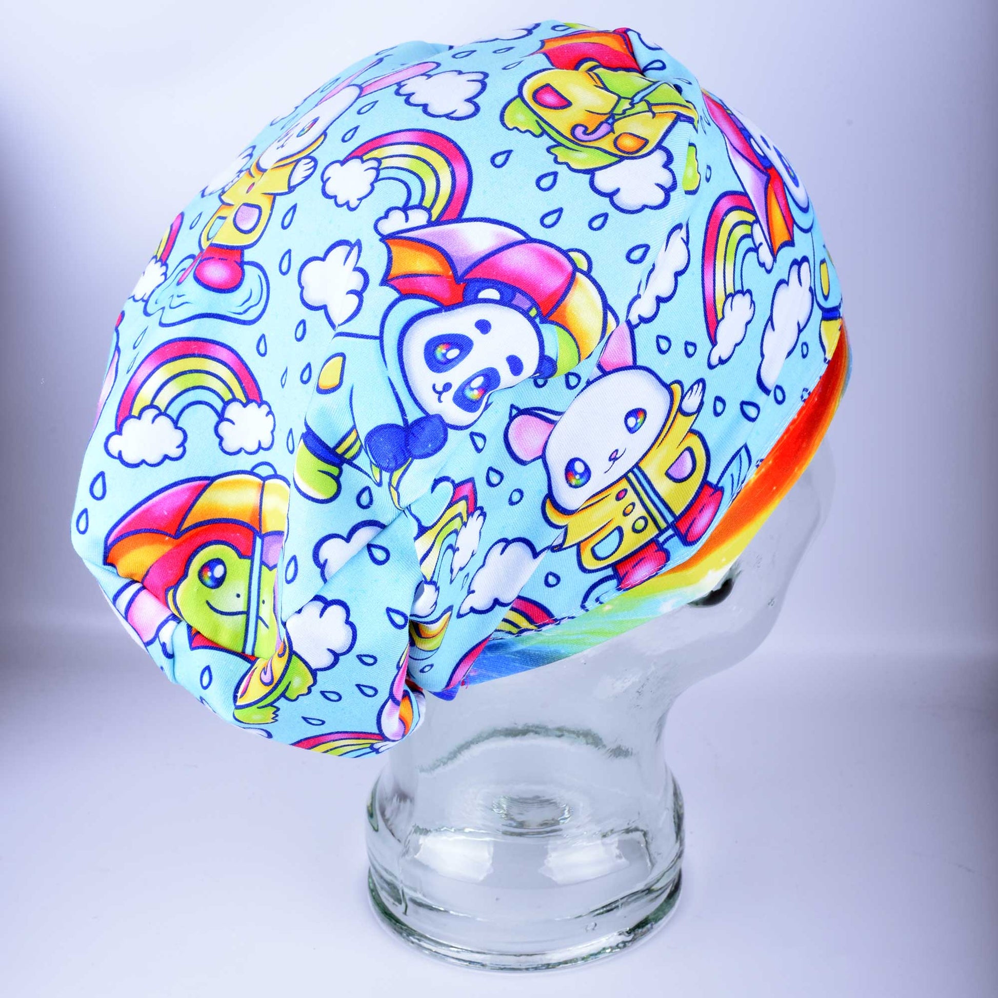 Rainy Days Euro-style scrub cap with blue and white raindrop pattern and adjustable toggle.