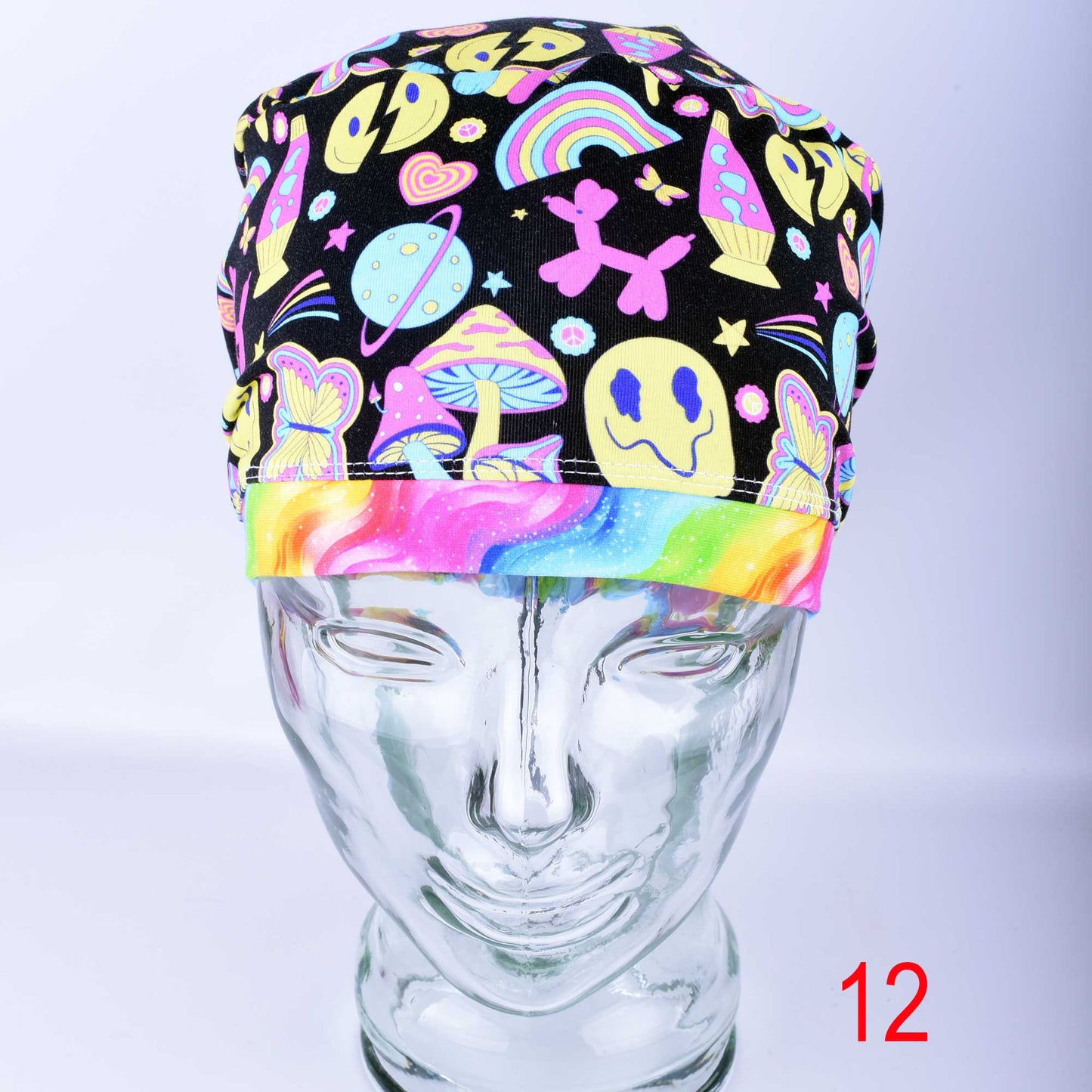 Front view of the Retro Days Full Coverage Scrub Cap on a clear mannequin head, showcasing the nostalgic 70s-inspired multicolor print and adjustable design.