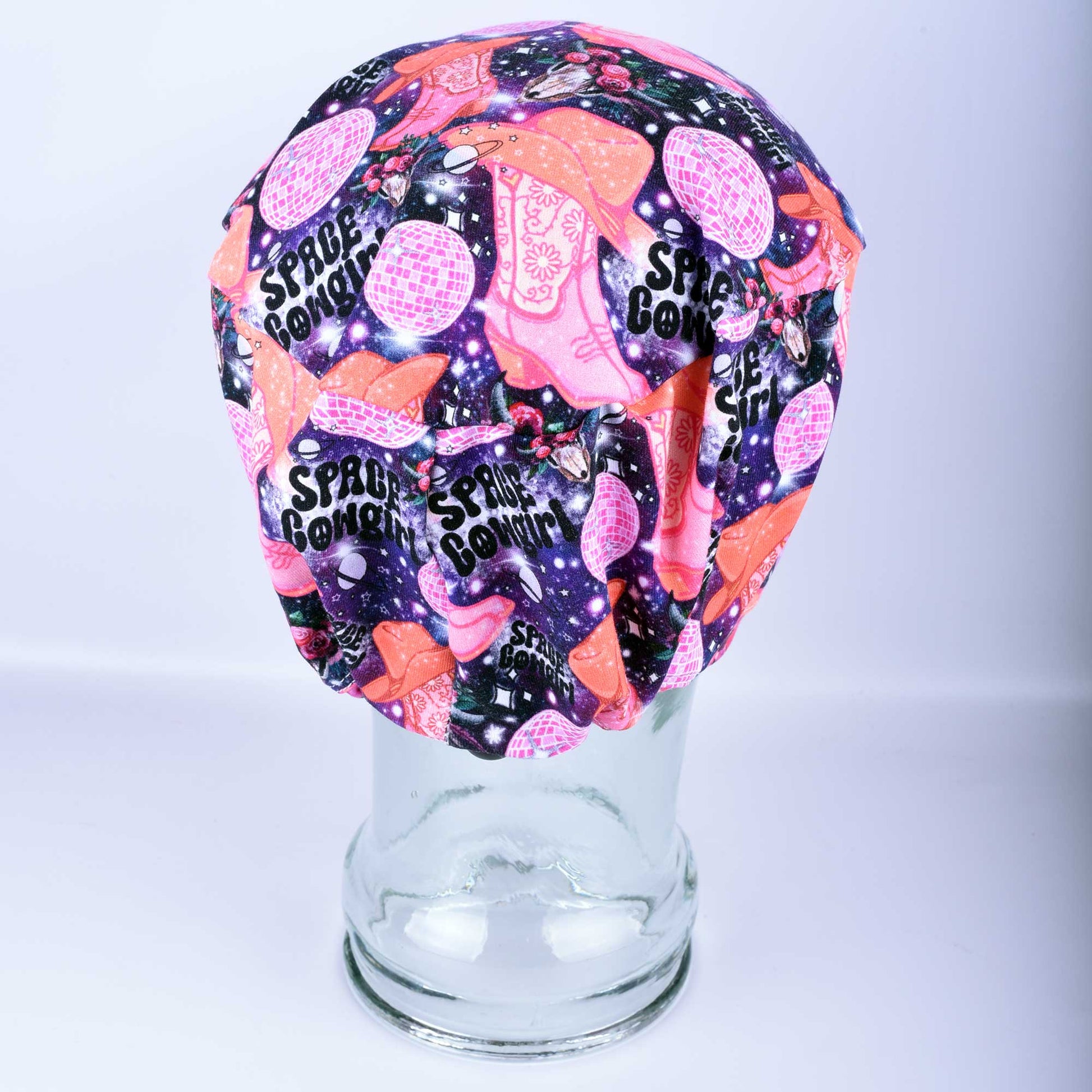 Rear view of a full coverage scrub hat showing the adjustable black cord lock toggle and elastic band for a customizable fit.