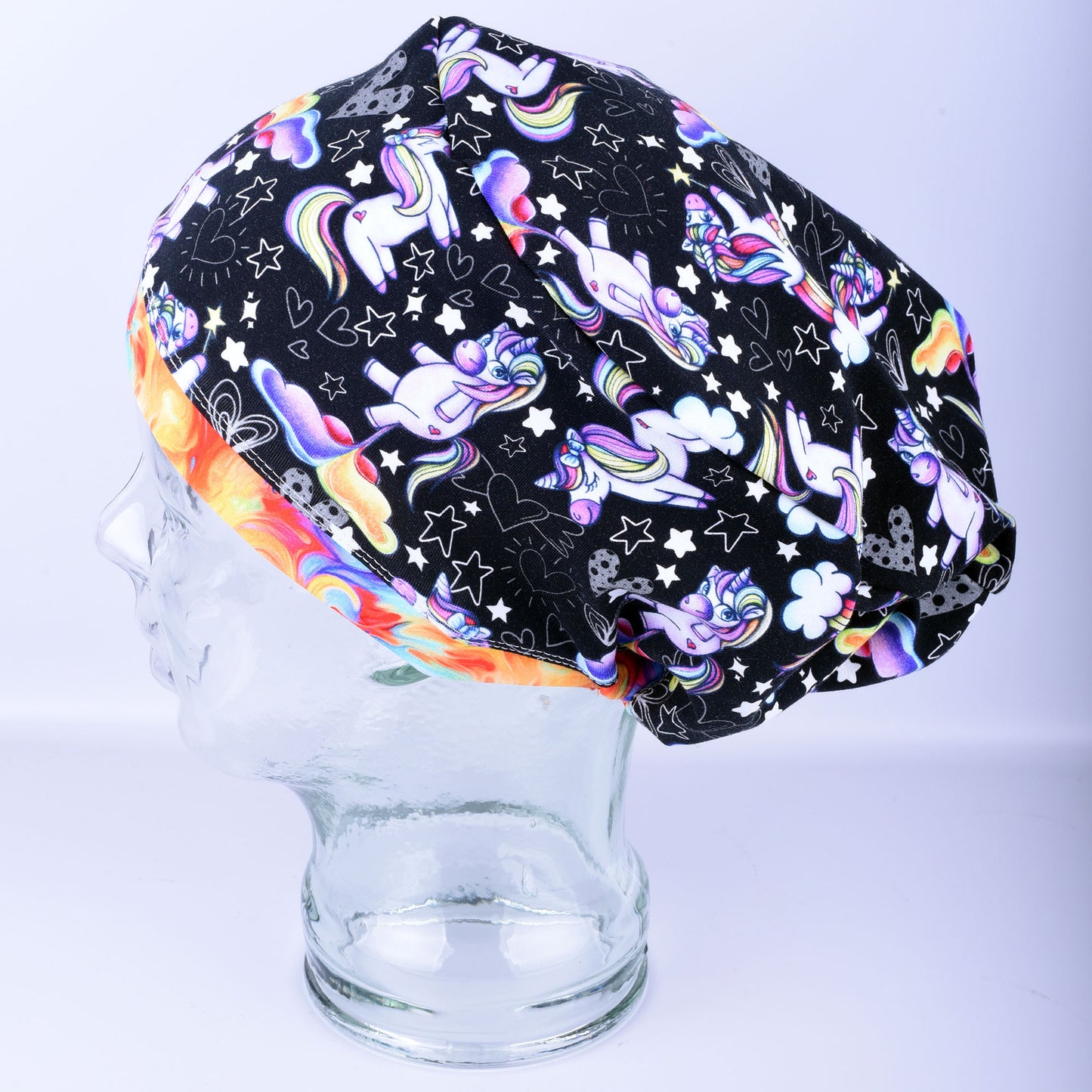 Side view of funny unicorns scrub cap showing full hair coverage and soft stretchy cotton knit fabric.