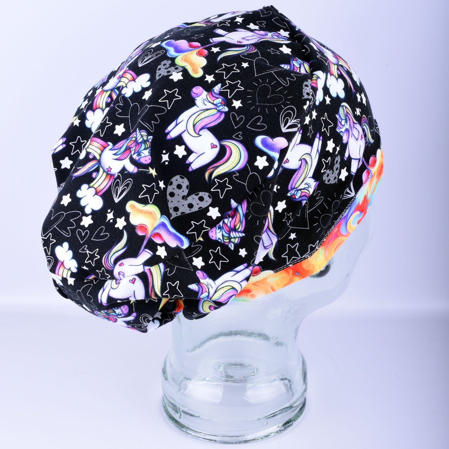 Side view of funny unicorns scrub cap showing full hair coverage and soft stretchy cotton knit fabric.