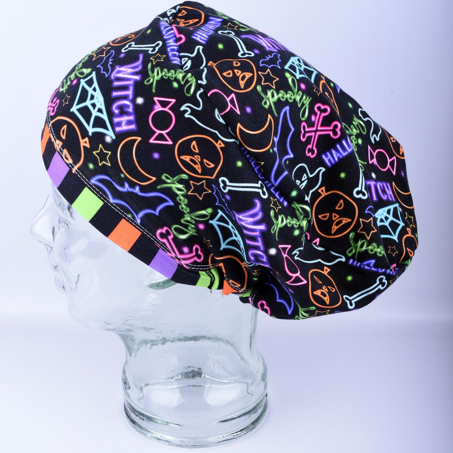 Halloween-themed scrub cap on a mannequin head against a white background