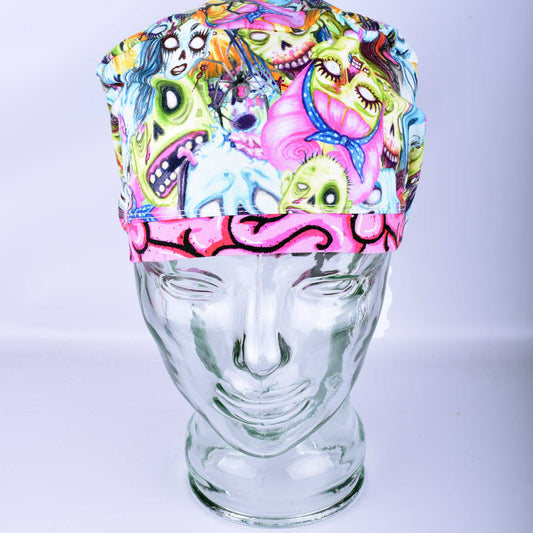 Supreme Zombies full coverage scrub cap featuring a colorful, hand-drawn zombie pattern with vibrant green, purple, and blue characters.