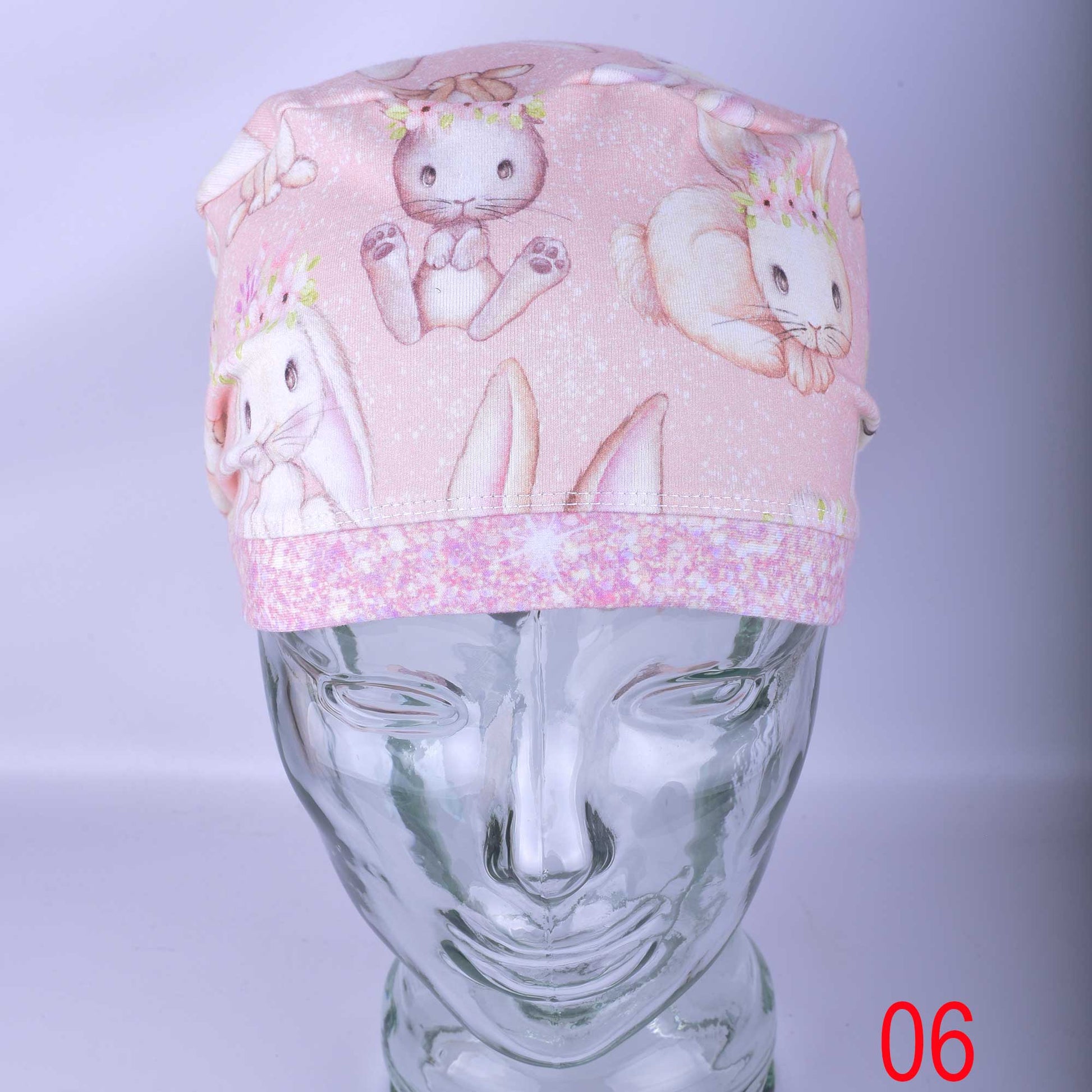 Full coverage adjustable surgical hat in Sweet Bunnies print with a secure cord lock toggle for a custom fit.