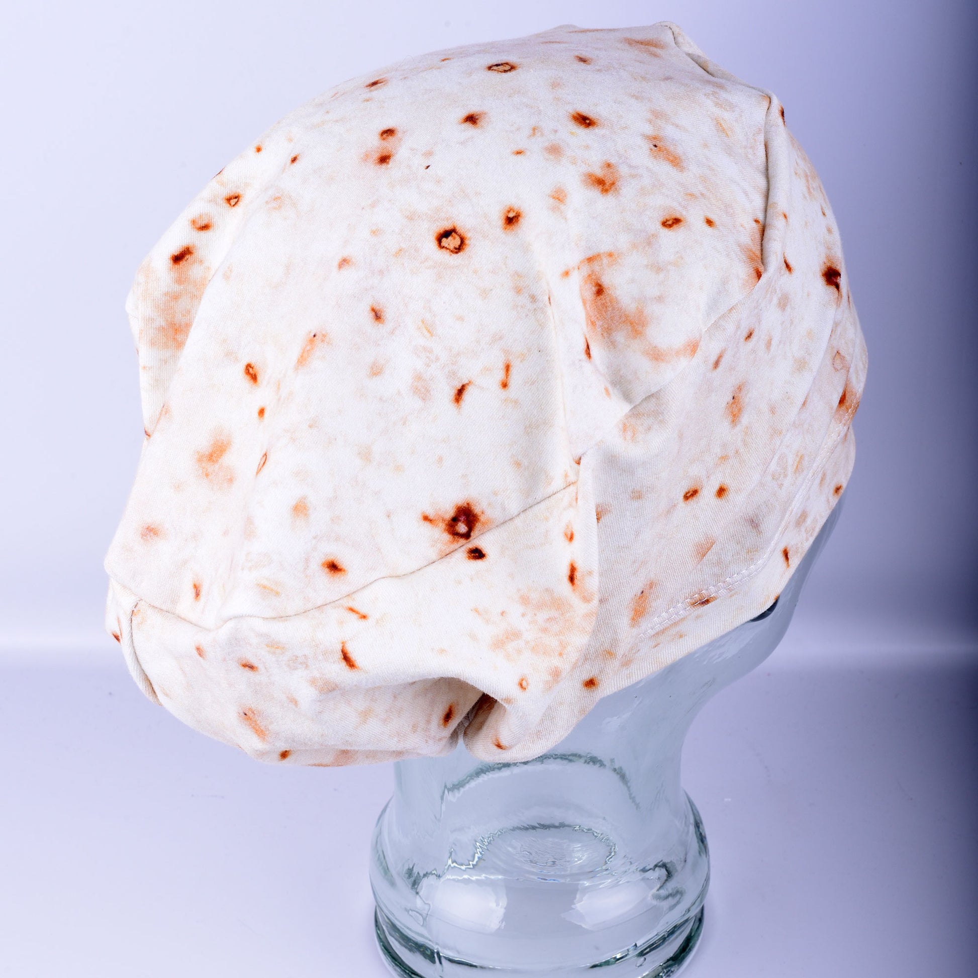 Side view of the Tortilla Scrub Cap showing the adjustable toggle closure and the soft, stretchy knit fabric fit.