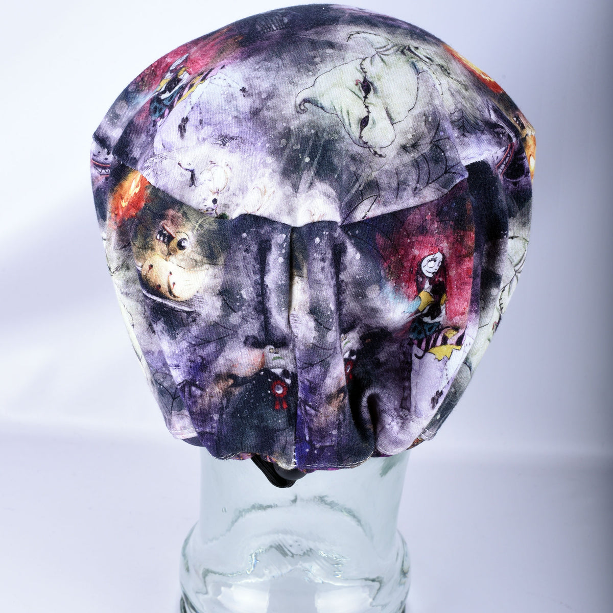 Back view of an adjustable full-coverage Halloween themed surgical cap displaying the elastic band and durable cord lock toggle closure for a secure fit.