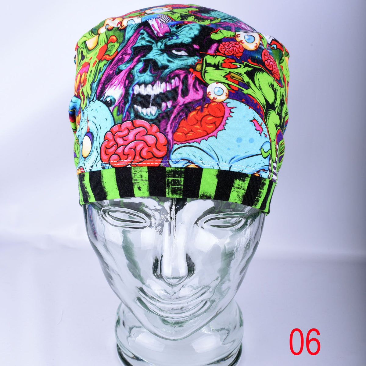 Close-up detail of the stretchy knit cotton-elastane fabric featuring a bright neon zombie and brain graphic pattern.